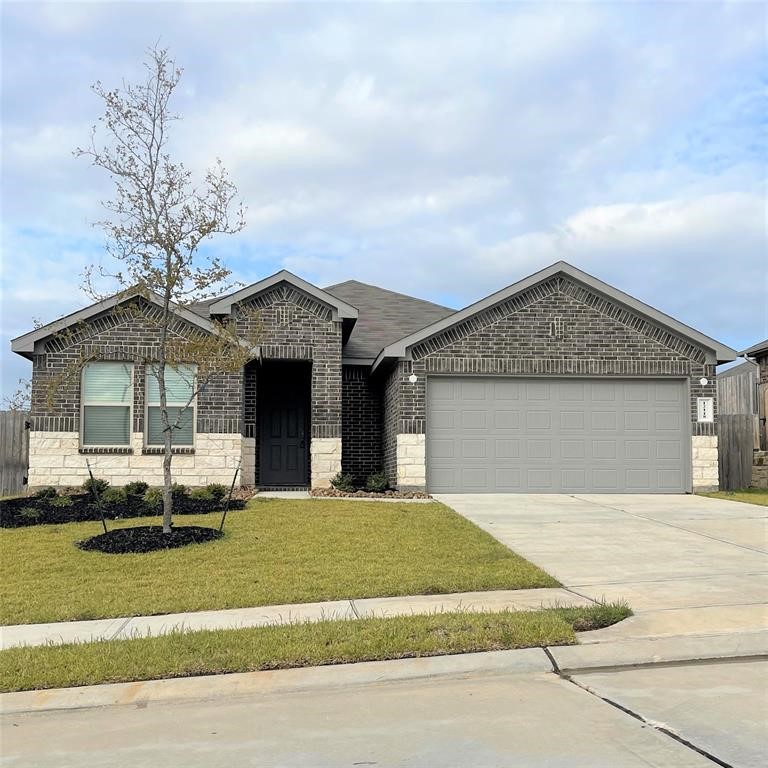 12118 Black Sage Court Conroe, TX 77304 - Photo 1 of 22 a front view of a house with a yard