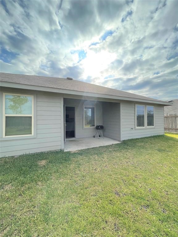 12118 Black Sage Court Conroe, TX 77304 - Photo 16 of 22 a view of a house with a backyard