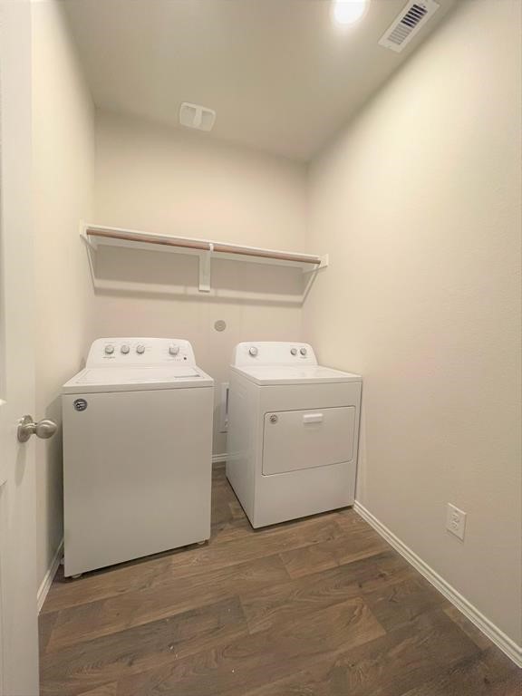 12118 Black Sage Court Conroe, TX 77304 - Photo 20 of 22 a utility room with dryer and washer