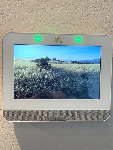 a view of a living room with a floor to ceiling window and floor
