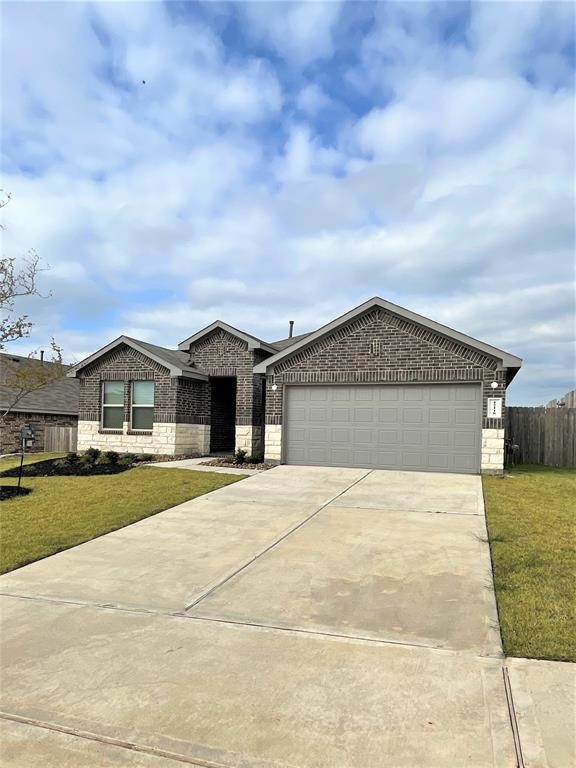 12118 Black Sage Court Conroe, TX 77304 - Photo 22 of 22 a front view of a house with yard