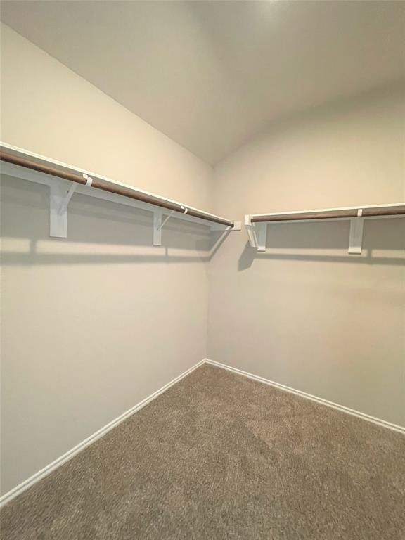 12118 Black Sage Court Conroe, TX 77304 - Photo 7 of 22 a view of a room with racks on the wall