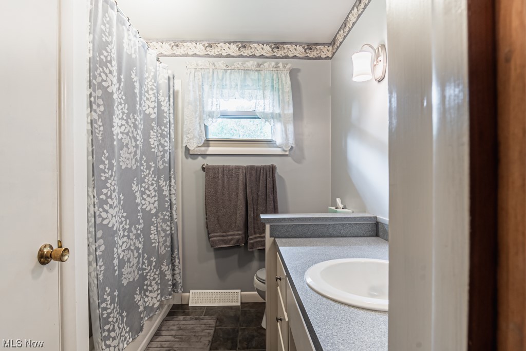 31207 Tower Road Salem, OH 44460 - Photo 22 of 34 Bathroom featuring tile floors, toilet, and vanity