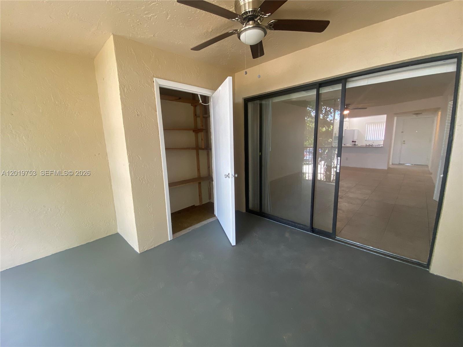 3410 Foxcroft Road, Unit 206 Miramar, FL 33025 - Photo 22 of 23 a view of empty room with a ceiling fan