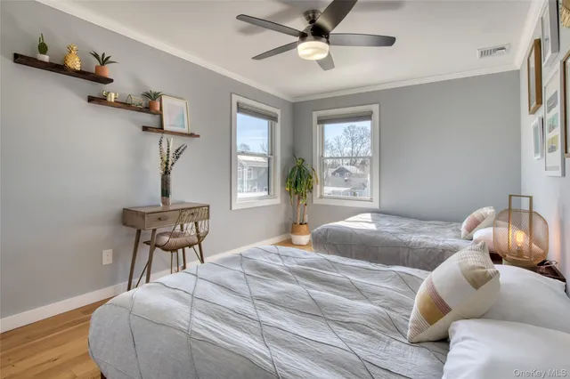 a bedroom with a bed and a chair