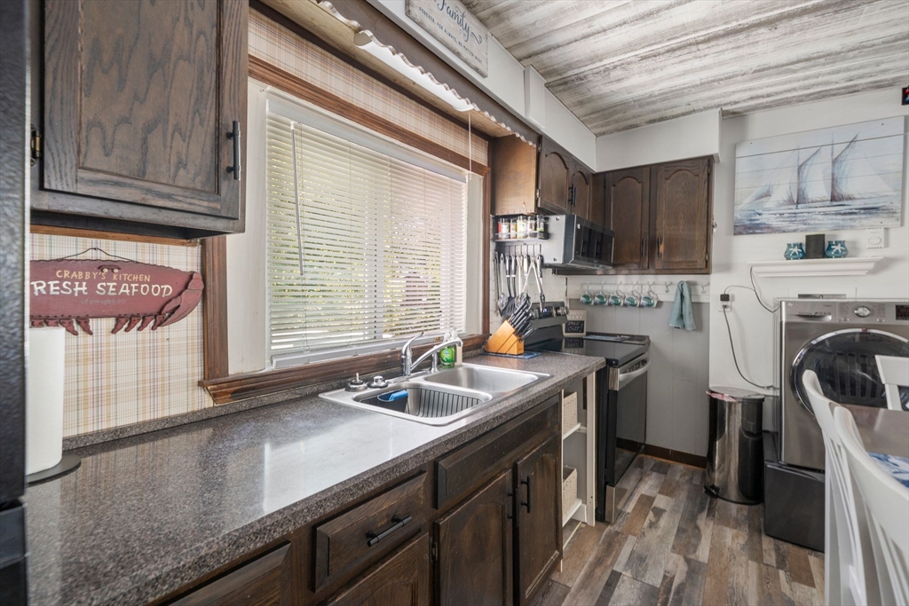 81 Constellation Road Marshfield, MA 02050 - Photo 11 of 42 a kitchen with a sink cabinets and window