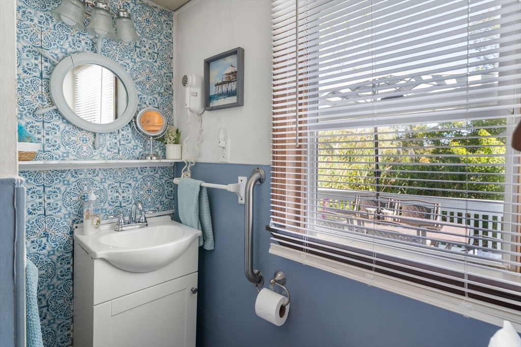 81 Constellation Road Marshfield, MA 02050 - Photo 13 of 42 a bathroom with a sink mirror vanity and toilet