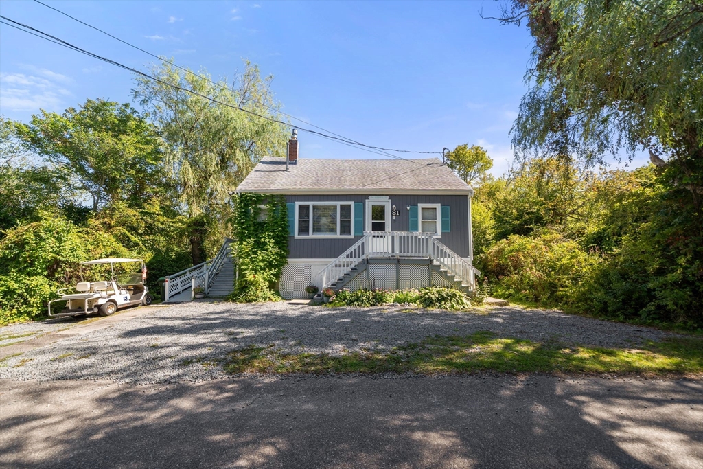 81 Constellation Road Marshfield, MA 02050 - Photo 21 of 42 a front view of a house with a yard and garage