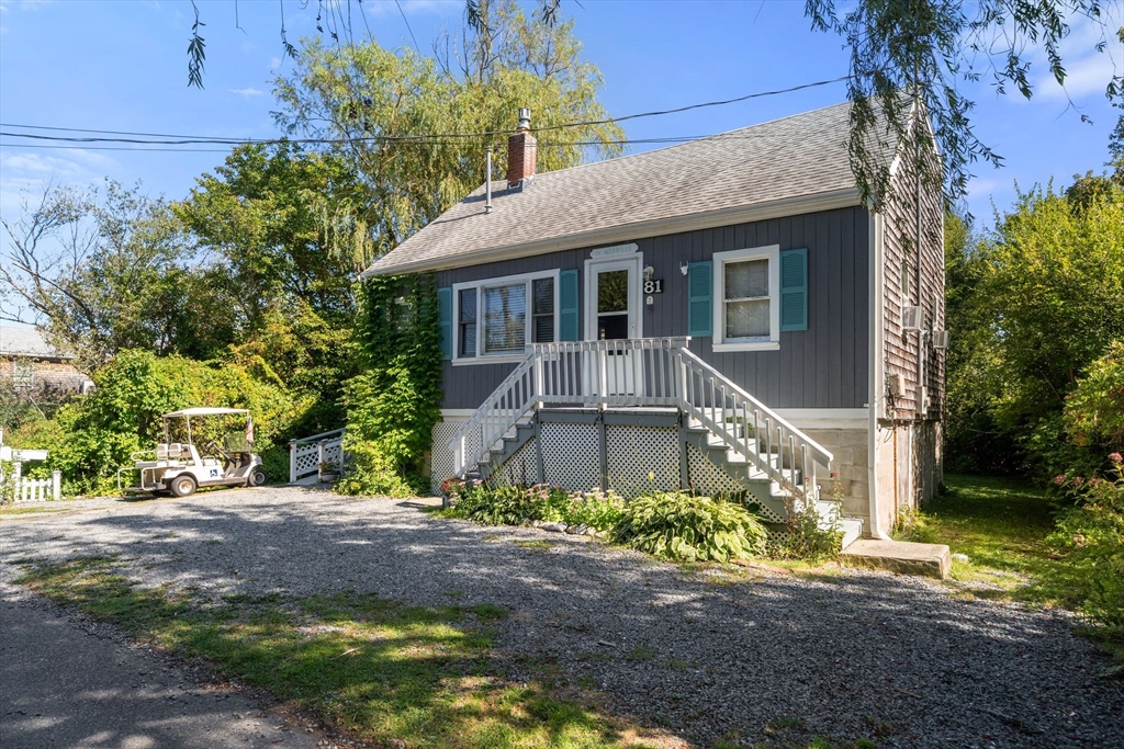 81 Constellation Road Marshfield, MA 02050 - Photo 23 of 42 a front view of a house with a yard
