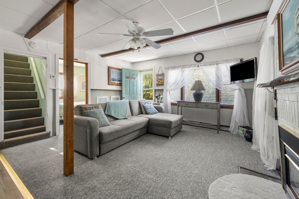 81 Constellation Road Marshfield, MA 02050 - Photo 5 of 42 a living room with furniture and a flat screen tv