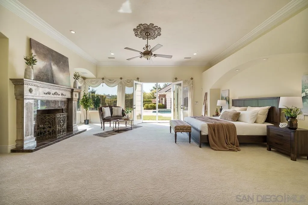13752 Paseo Valle Alto Poway, CA 92064 - Photo 23 of 73 a living room with furniture large fireplace and a fireplace