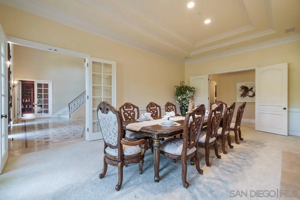 13752 Paseo Valle Alto Poway, CA 92064 - Photo 32 of 73 a view of a dining room and livingroom with furniture wooden floor and a rug