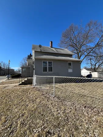 a house with trees in front of it