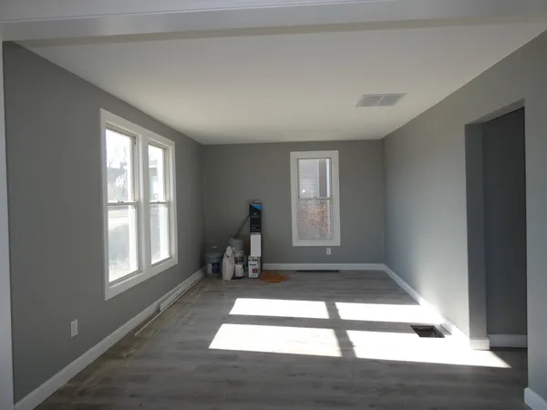 a view of an empty room and window