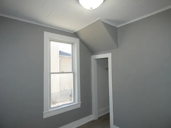 a view of an empty room with a window