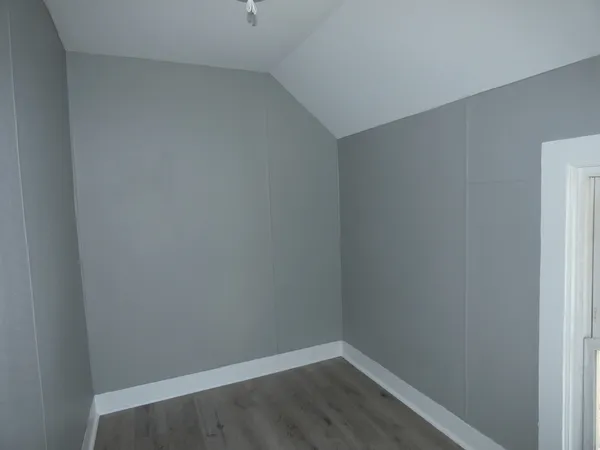 a empty room with wooden floor
