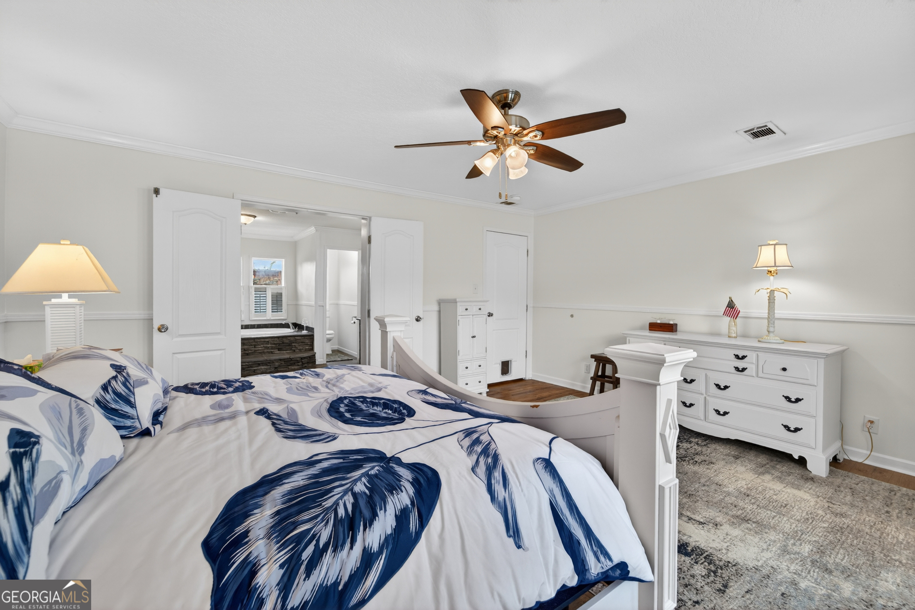 1953 Raybon Road West Hoboken, GA 31542 - Photo 14 of 31 a bed room with a bed and a chandelier