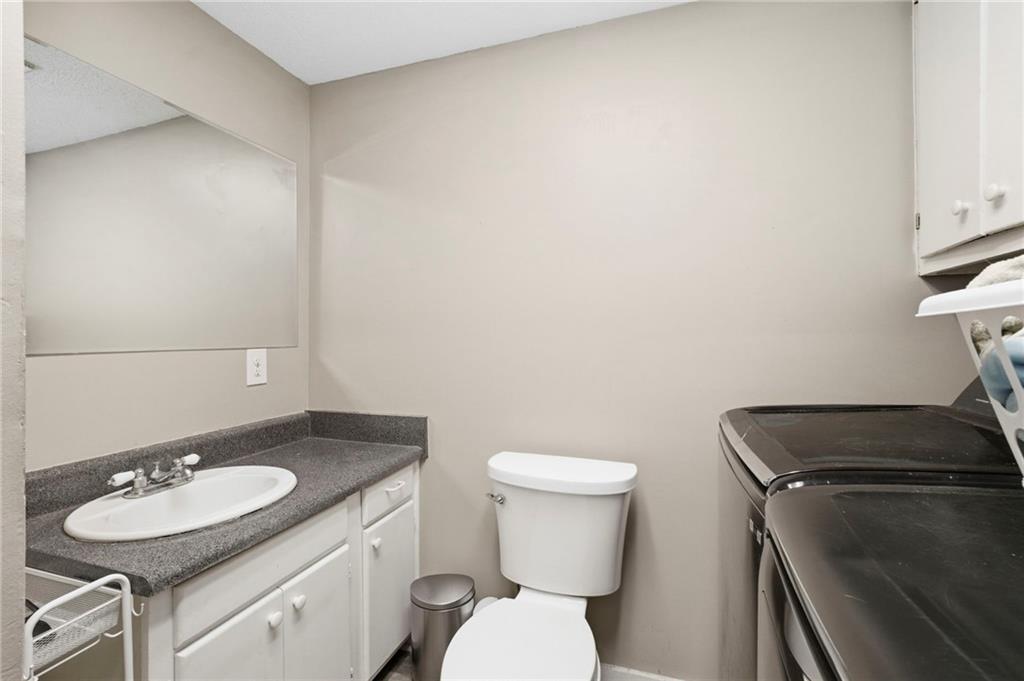 400 Sam Love Road Rocky Face, GA 30740 - Photo 20 of 29 a bathroom with a sink toilet and mirror