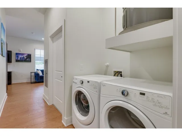 a kitchen with stainless steel appliances refrigerator stove and microwave