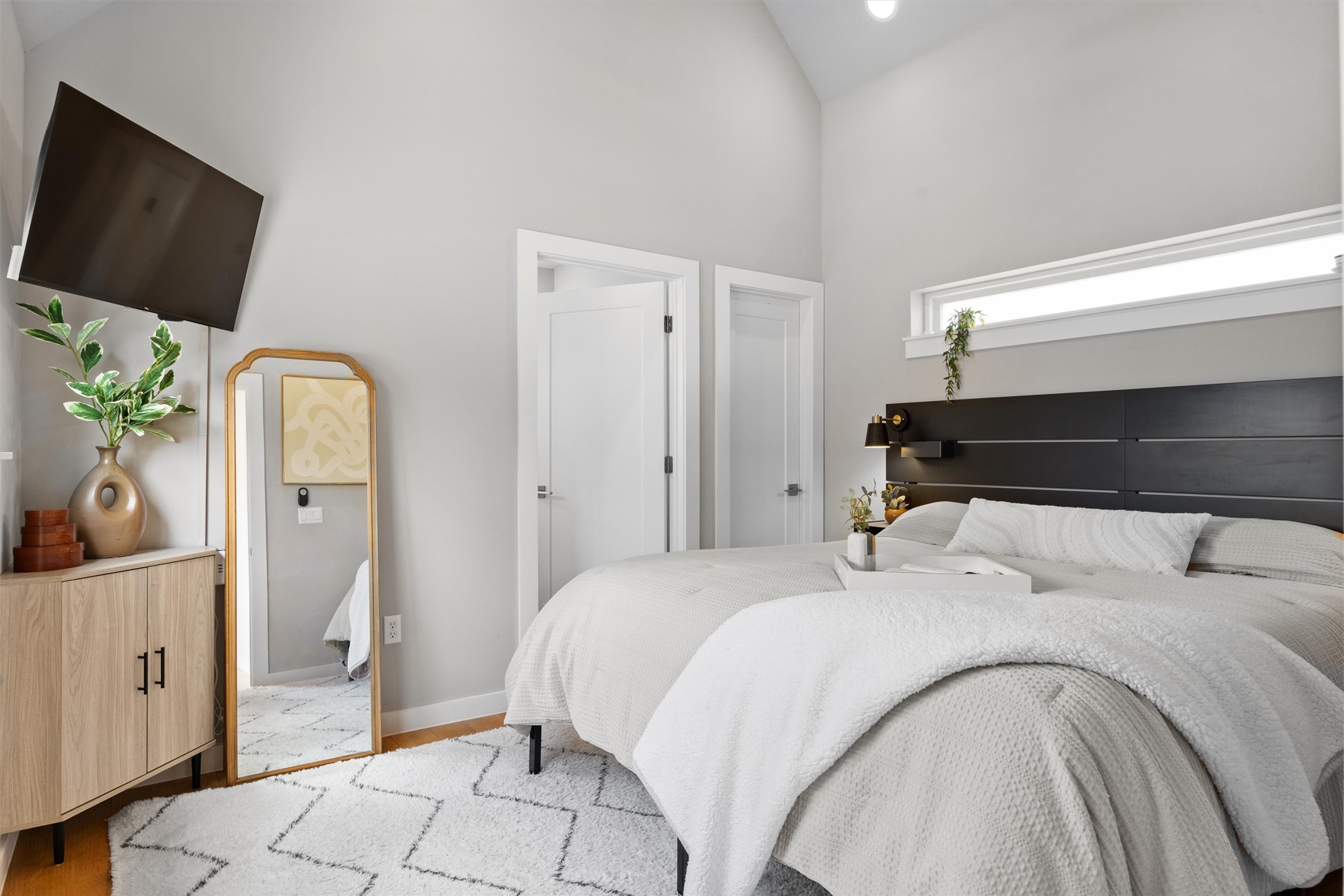 1116 Stobaugh Street, Unit B Austin, TX 78757 - Photo 7 of 38 The primary suite features vaulted ceilings and a bright, airy feel.
