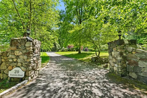 a view of a street with a tree