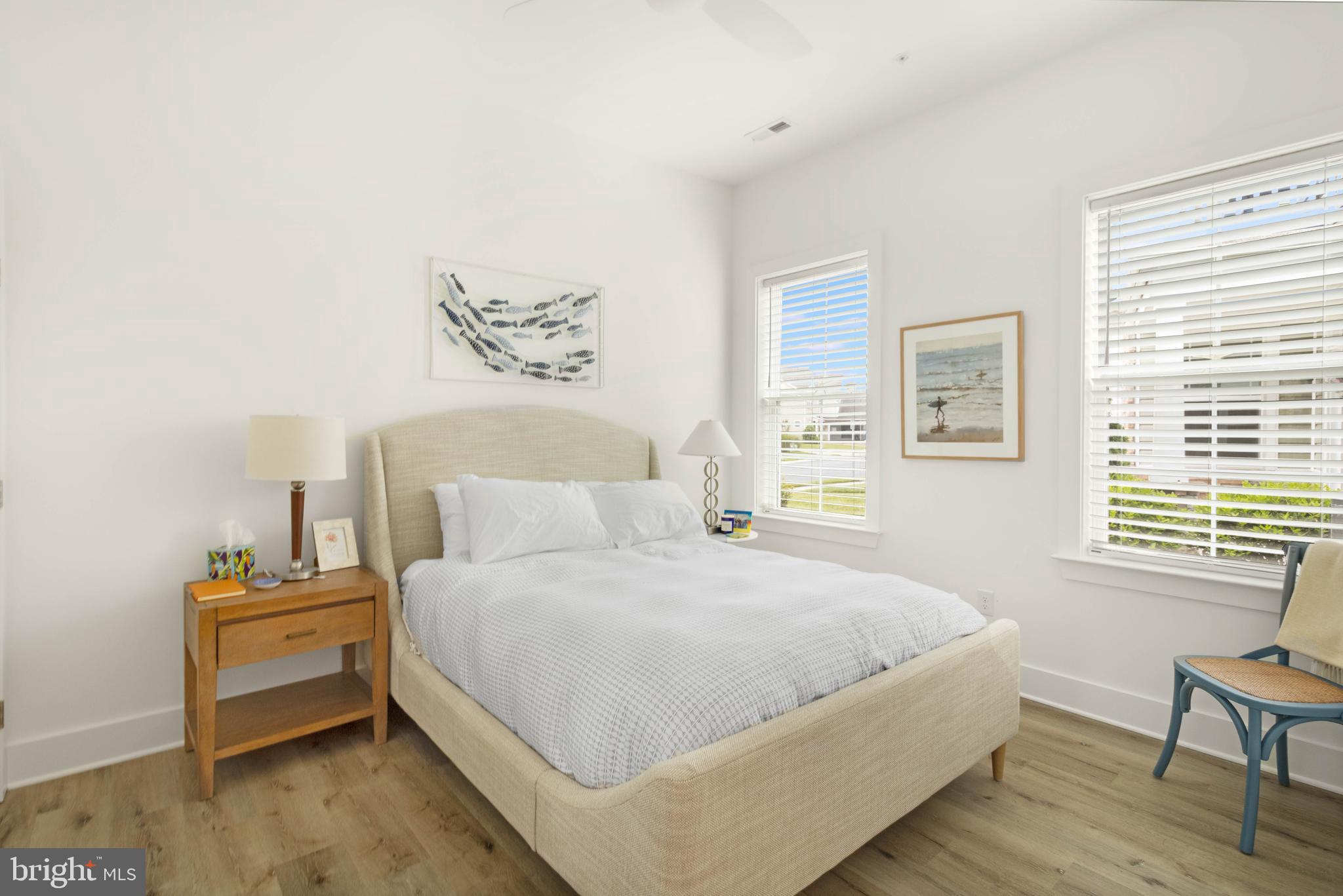 2 Bowers Drive, Unit 103 Ocean View, DE 19970 - Photo 14 of 52 a bedroom with a bed and wooden floor