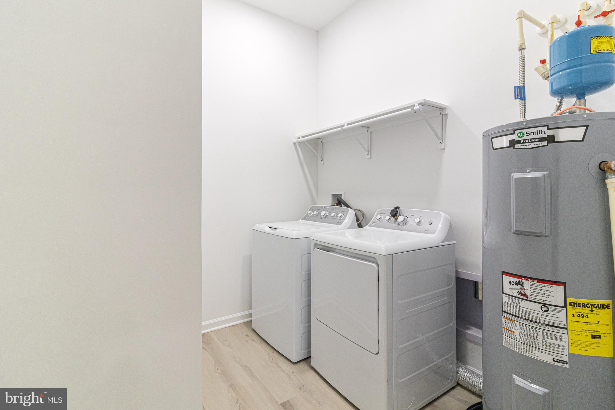 2 Bowers Drive, Unit 103 Ocean View, DE 19970 - Photo 20 of 52 a utility room with dryer and washer