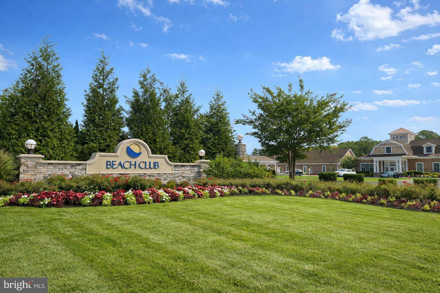 2 Bowers Drive, Unit 103 Ocean View, DE 19970 - Photo 31 of 52 a front view of a house with a yard and trees