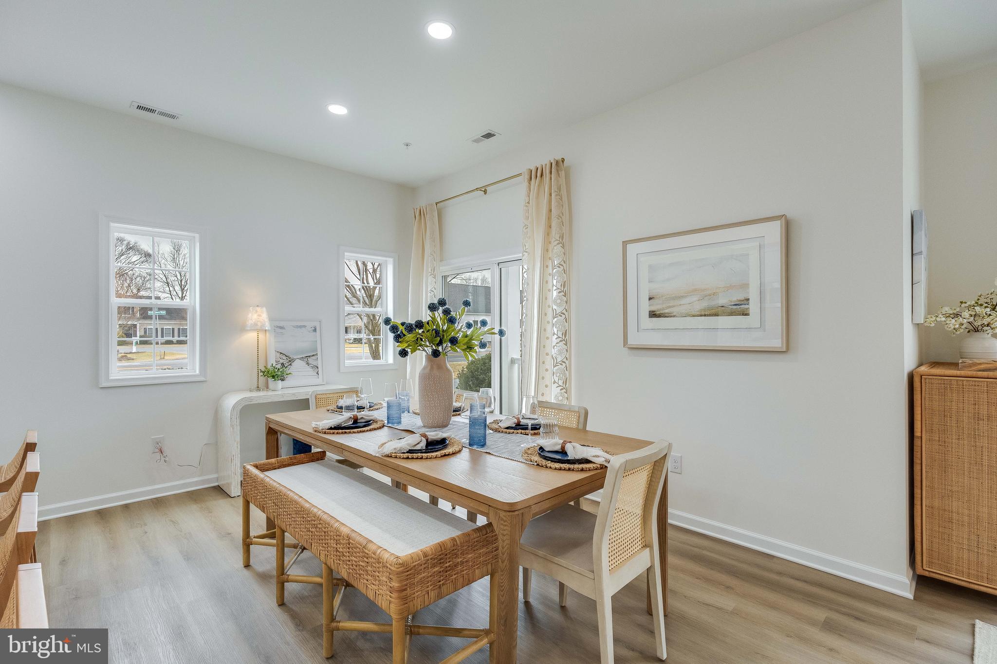 2 Bowers Drive, Unit 103 Ocean View, DE 19970 - Photo 10 of 52 a view of a dining room with furniture and wooden floor