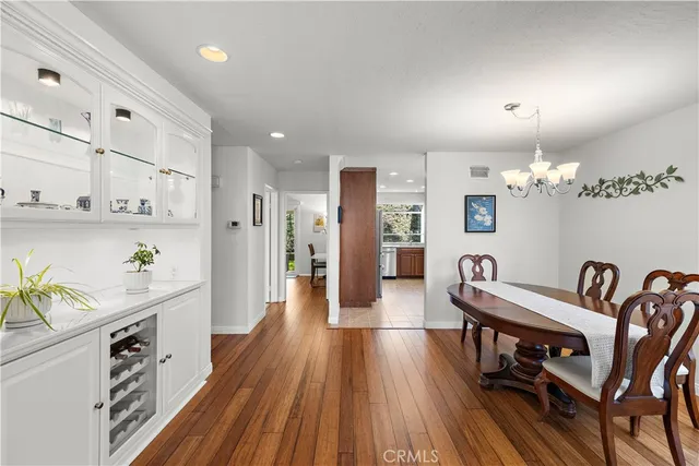 a kitchen with stainless steel appliances granite countertop a refrigerator stove and sink