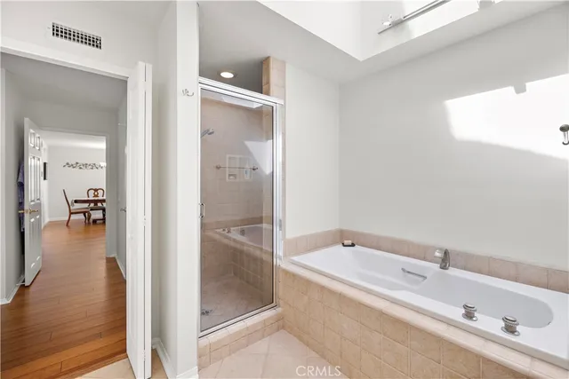 a bathroom with a granite countertop sink toilet a mirror and shower