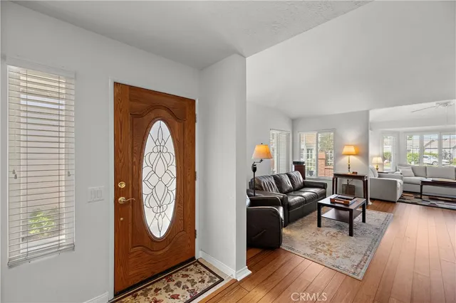 an aerial view of residential houses with outdoor space and swimming pool