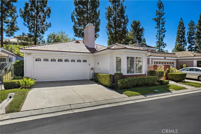an aerial view of a house with a garden