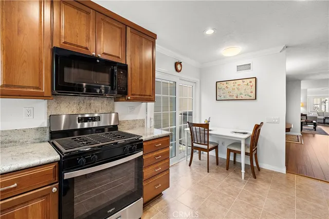 a view of a a dining room with furniture window and wooden floor