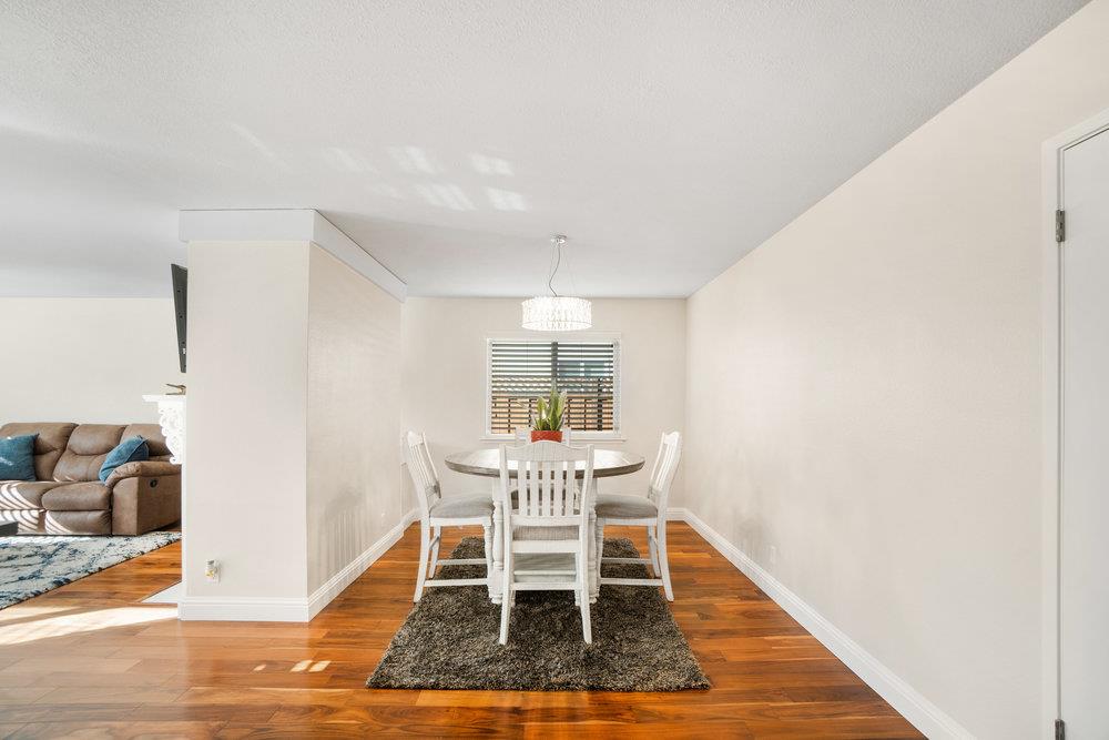 1408 Eagles Nest Lane Gilroy, CA 95020 - Photo 14 of 43 a dining room with furniture a rug and wooden floor
