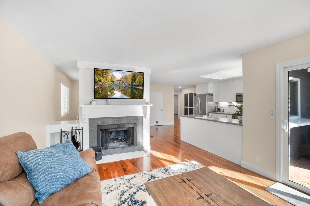 1408 Eagles Nest Lane Gilroy, CA 95020 - Photo 17 of 43 a living room with furniture and a fireplace