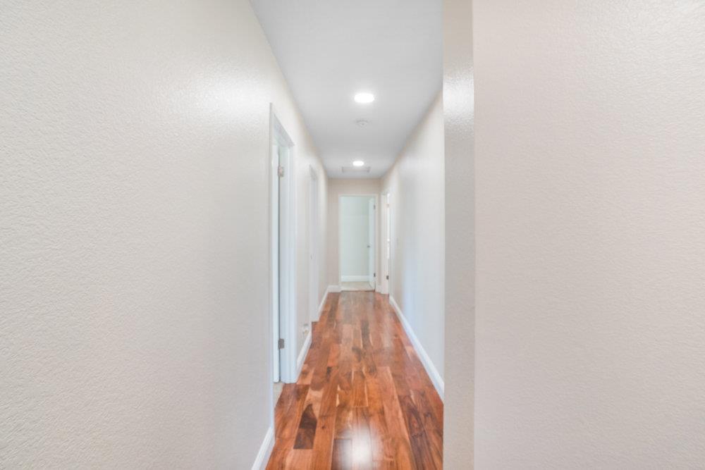 1408 Eagles Nest Lane Gilroy, CA 95020 - Photo 19 of 43 a view of a hallway with a white walls