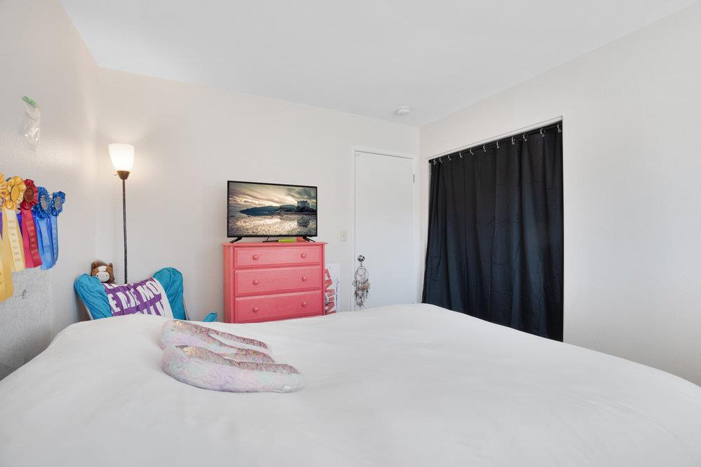 1408 Eagles Nest Lane Gilroy, CA 95020 - Photo 24 of 43 a bedroom with a bed and a tv