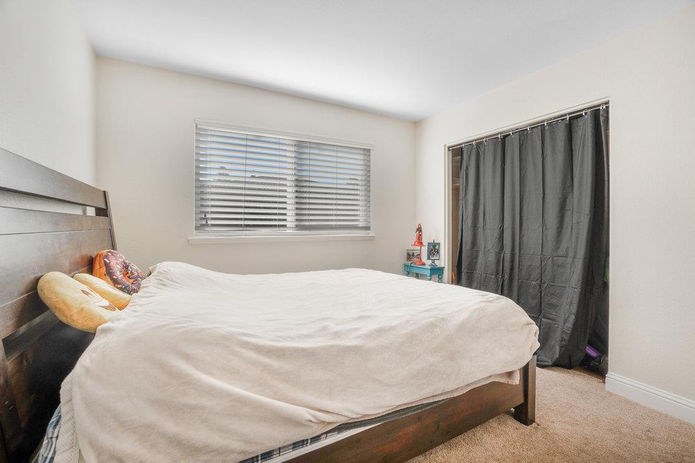 1408 Eagles Nest Lane Gilroy, CA 95020 - Photo 27 of 43 a bedroom with a bed and a window