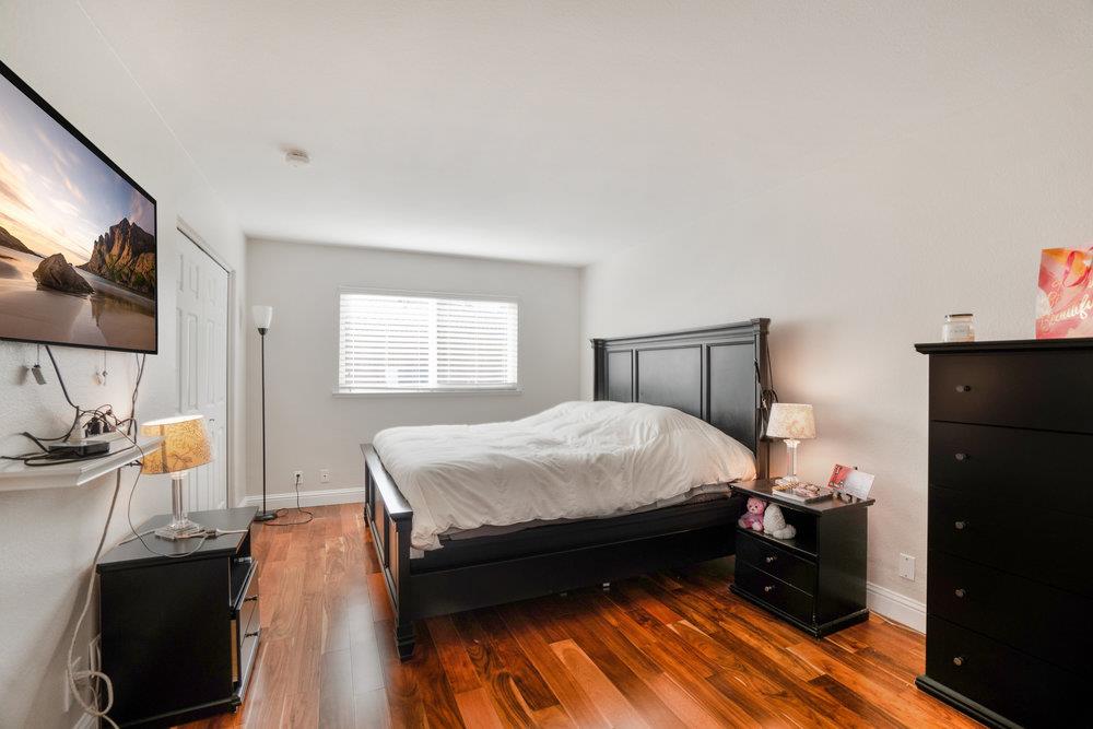 1408 Eagles Nest Lane Gilroy, CA 95020 - Photo 30 of 43 a bedroom with a bed and a flat tv screen on dresser