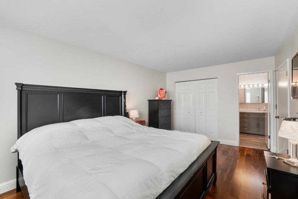 1408 Eagles Nest Lane Gilroy, CA 95020 - Photo 32 of 43 a large bed in a bedroom and a mirror