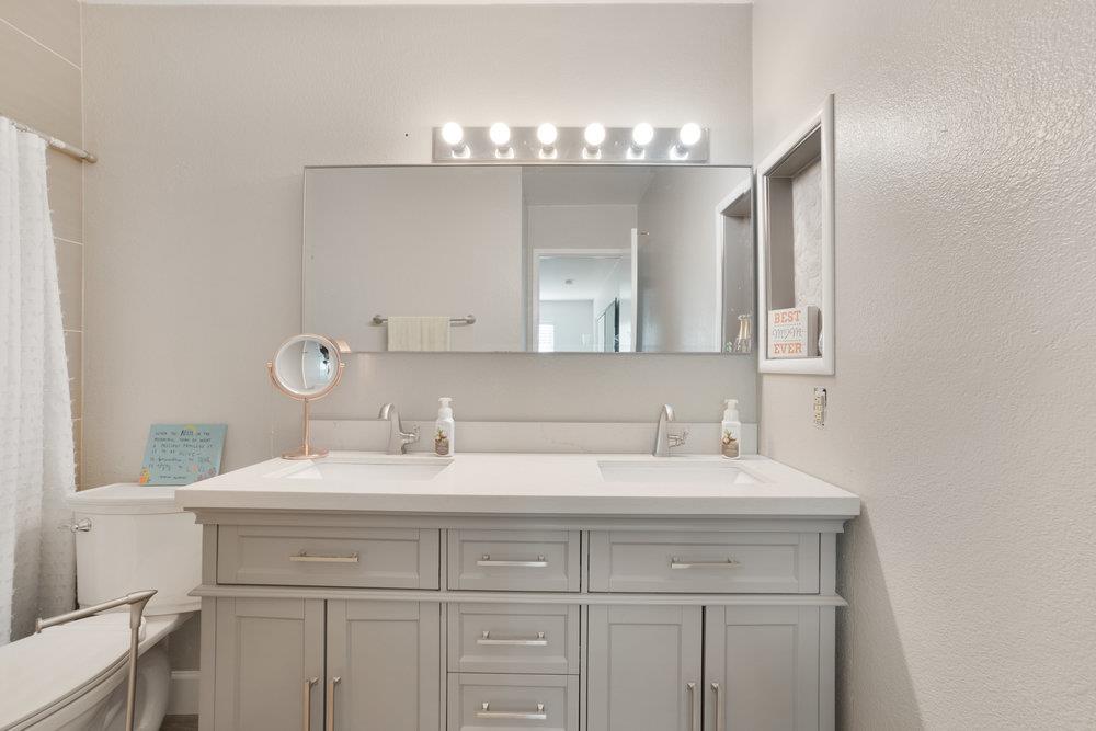 1408 Eagles Nest Lane Gilroy, CA 95020 - Photo 33 of 43 a bathroom with a sink vanity and a mirror