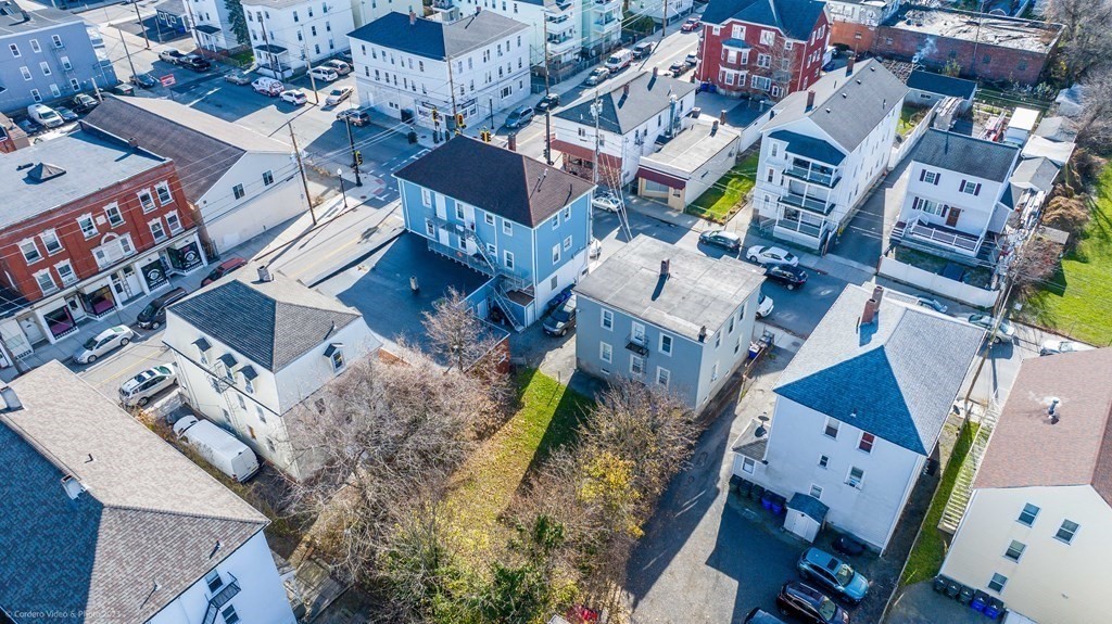 an aerial view of residential houses with outdoor space