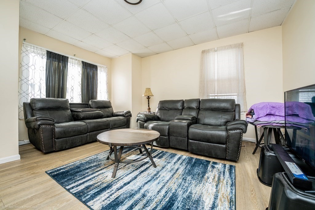 772 Globe Street Fall River, MA 02724 - Photo 13 of 23 a living room with furniture and wooden floor