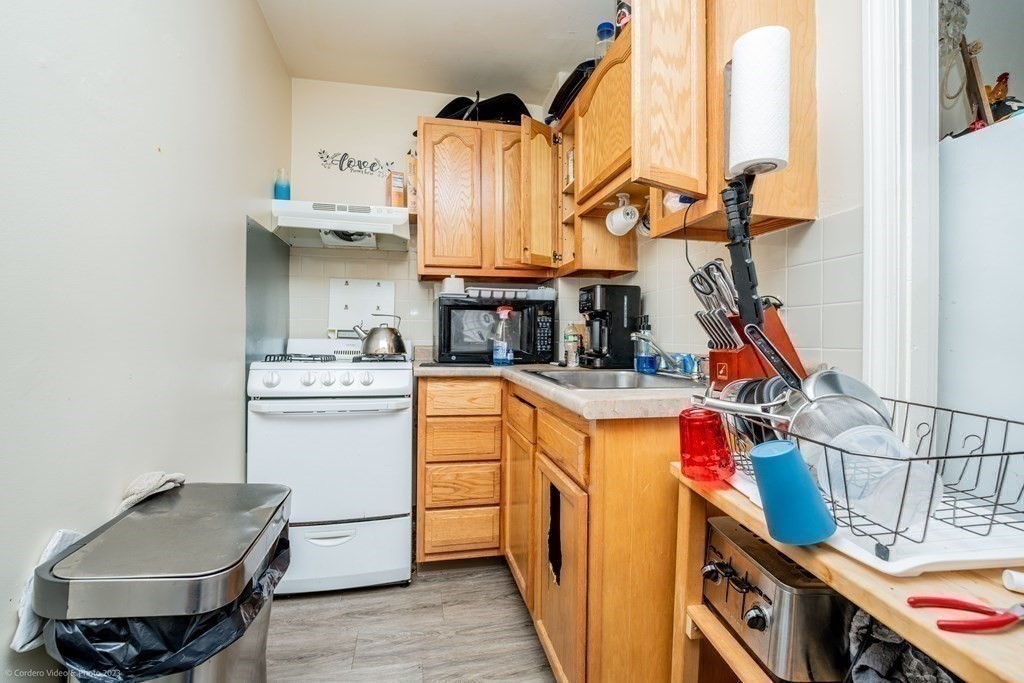 772 Globe Street Fall River, MA 02724 - Photo 18 of 23 a utility room with sink dryer and washer