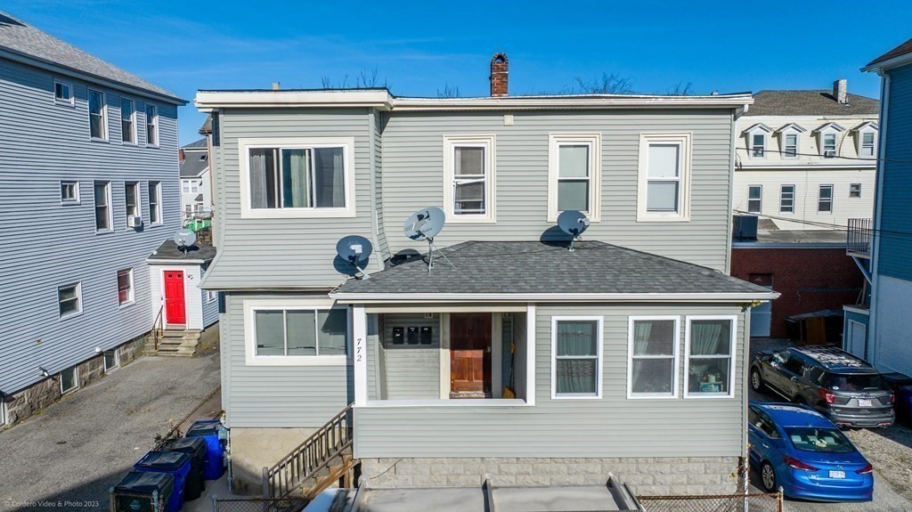 772 Globe Street Fall River, MA 02724 - Photo 4 of 23 a front view of a house with a yard