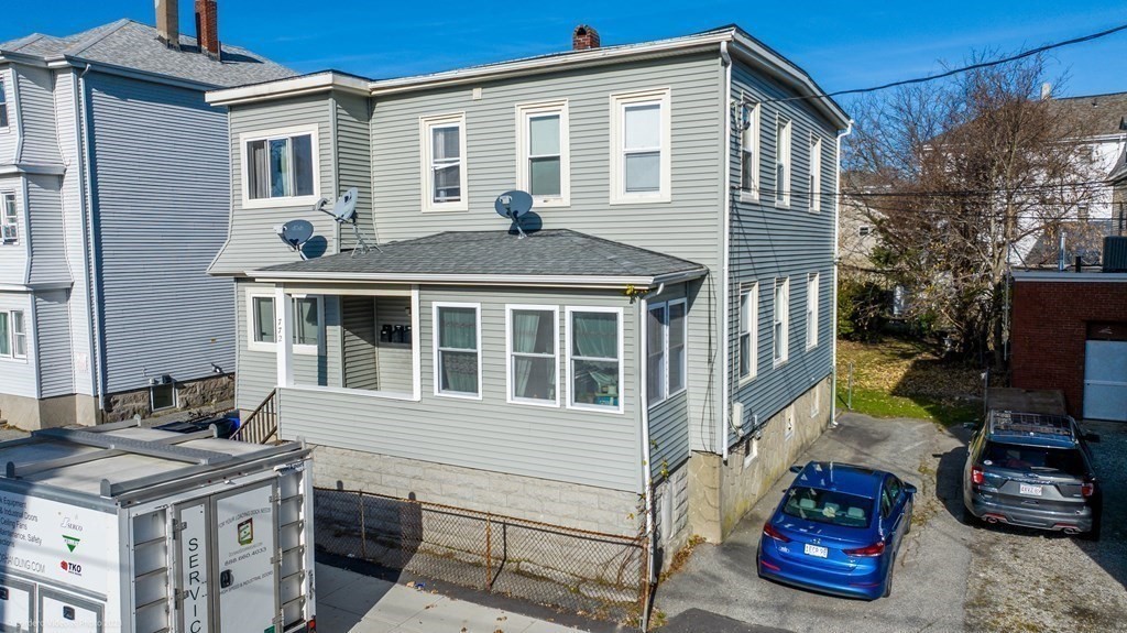 772 Globe Street Fall River, MA 02724 - Photo 5 of 23 a front view of a house with parking space