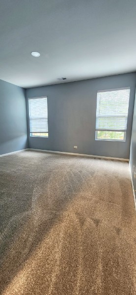 24113 Walnut Circle Plainfield, IL 60585 - Photo 11 of 21 a view of an empty room with a window