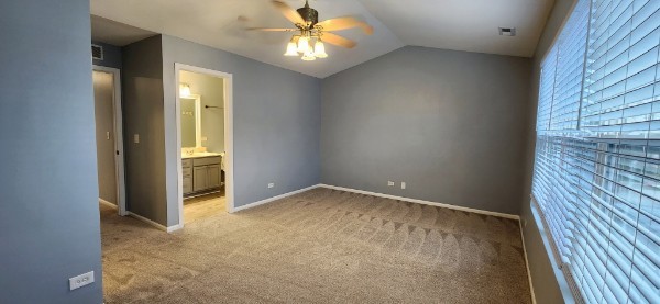 24113 Walnut Circle Plainfield, IL 60585 - Photo 17 of 21 an empty room with closet and a chandelier fan