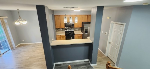 24113 Walnut Circle Plainfield, IL 60585 - Photo 3 of 21 a view of a kitchen from the hallway